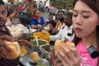 An influencer from Hong Kong orders in Marathi after trying vada pav from a streetside stall in Mumbai!